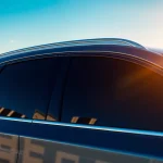 Enhance your vehicle's style and privacy with window tint Chattanooga, showcased on a modern car in an urban setting.